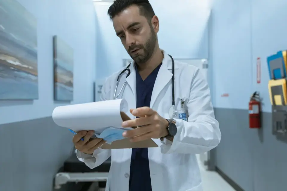 A veterinarian examining a dog supplement label and ingredient panel