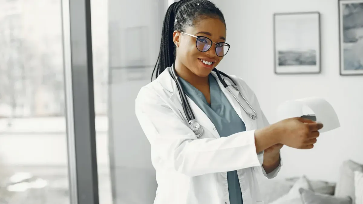A veterinarian in an exam room reading the ingredient panel on a dog supplement bottle