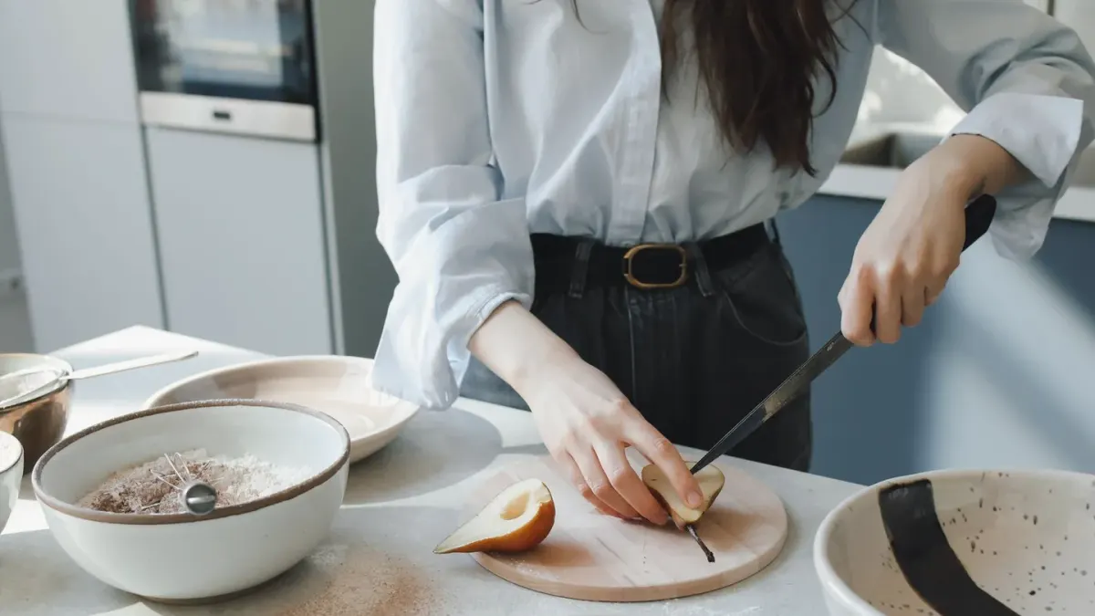Dog owner preparing dog food kitchen