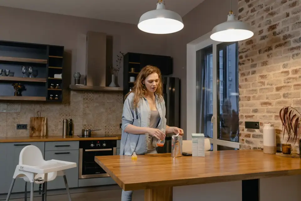 Dog owner preparing dog food kitchen