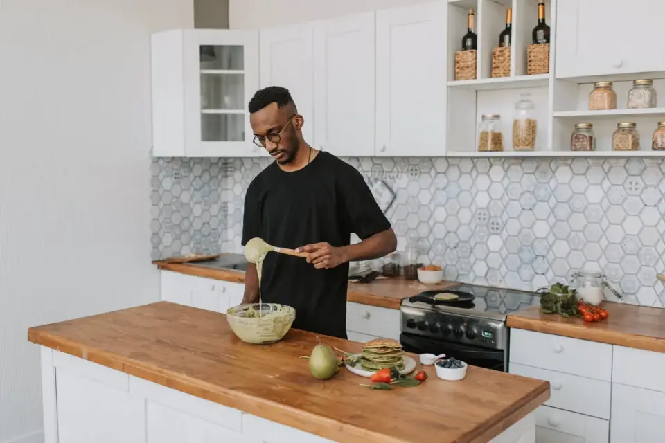 Dog owner preparing dog food kitchen