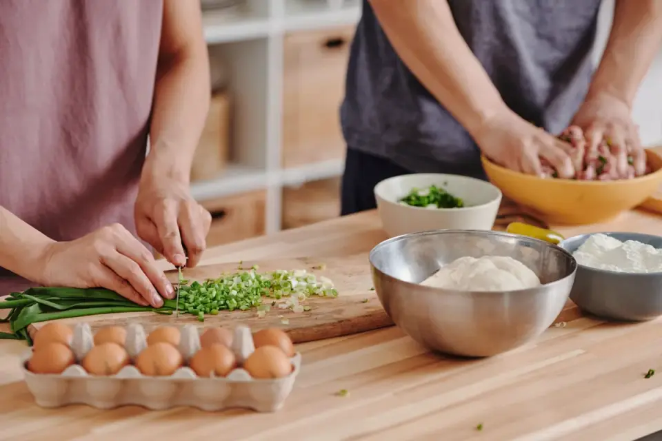 Dog owner preparing dog food kitchen