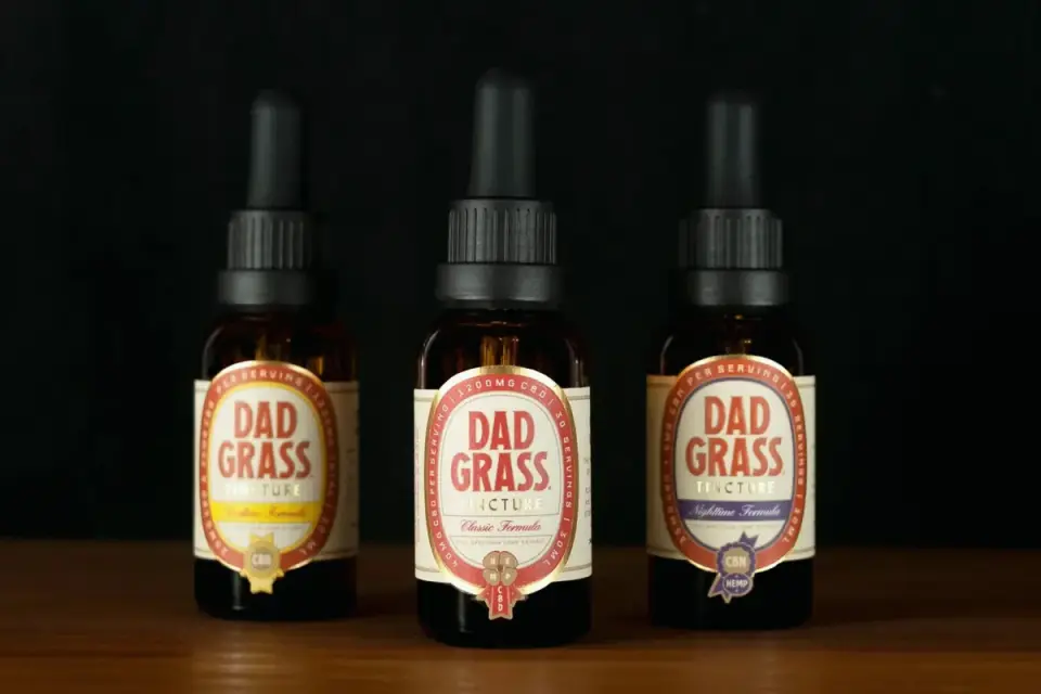 Row of dog supplement bottles showing a quality certification seal on the packaging